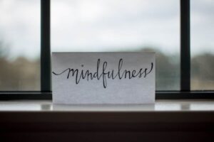 sign on windowsill that says mindfulness