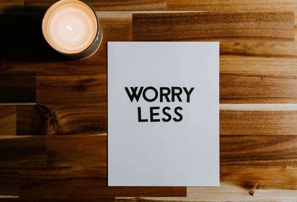 sign on a table that says worry less