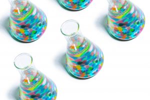 lab beakers with colorful chemicals inside